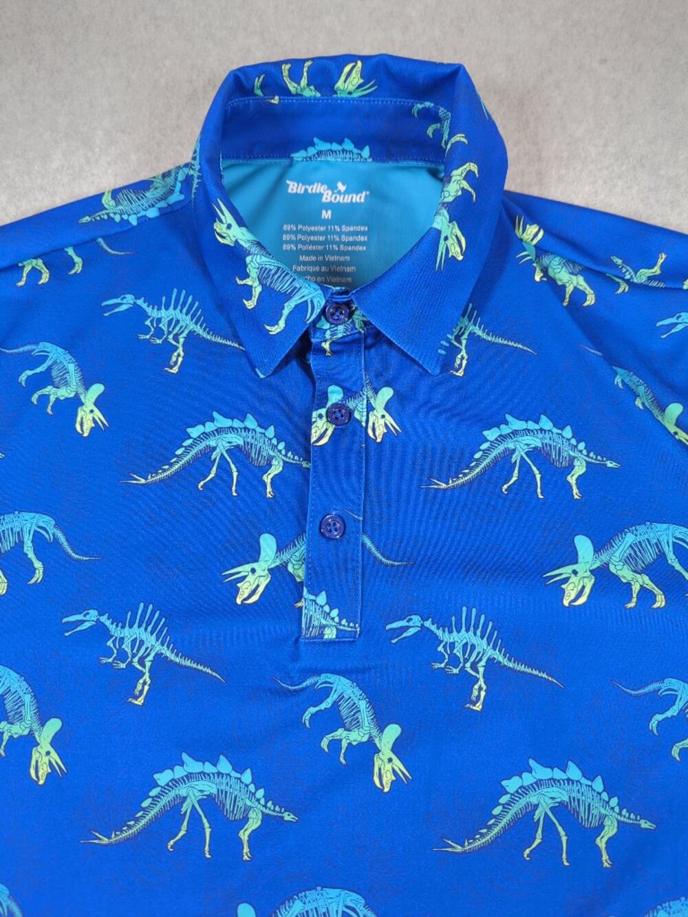 Birdie Bound Polo Shirt Men's Medium Blue Golf Performance Stretch Dinosaurs